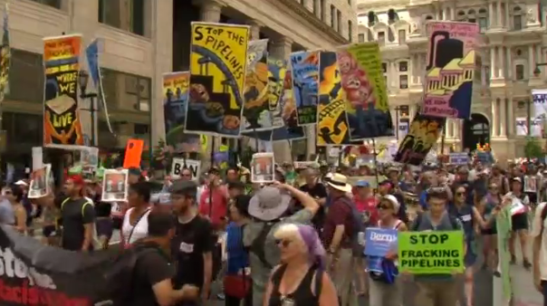 Thousands of protesters took to the streets of downtown Philadelphia to voice their displeasure over the treatment Bernie Sanderss received from the Democratic National Committee (DNC).  (Photo grabbed from Reuters video/Courtesy Reuters)