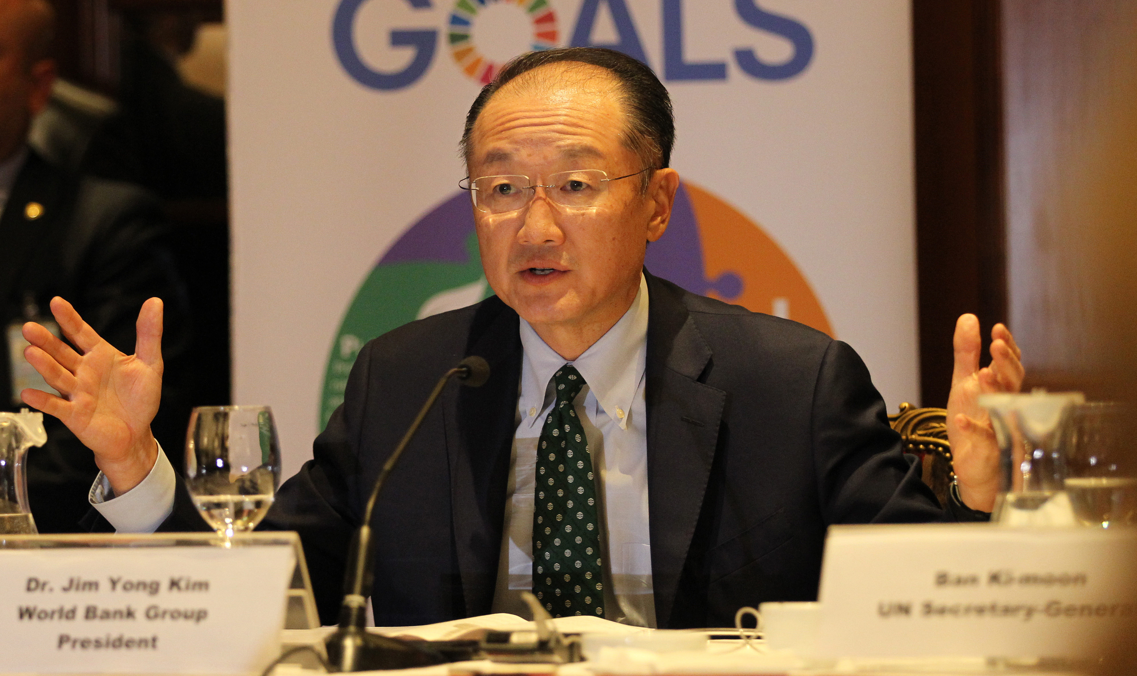 World Bank chief Jim Yong Kim gestures during a joint press conference with the head of Islamic Development Bank head and with UN Secretary-General a Beirut hotel on March 25, 2016.  Ban urged an end to war and violence in Syria and the region, as he wrapped up a two-day visit to Lebanon.  / AFP PHOTO / ANWAR AMRO