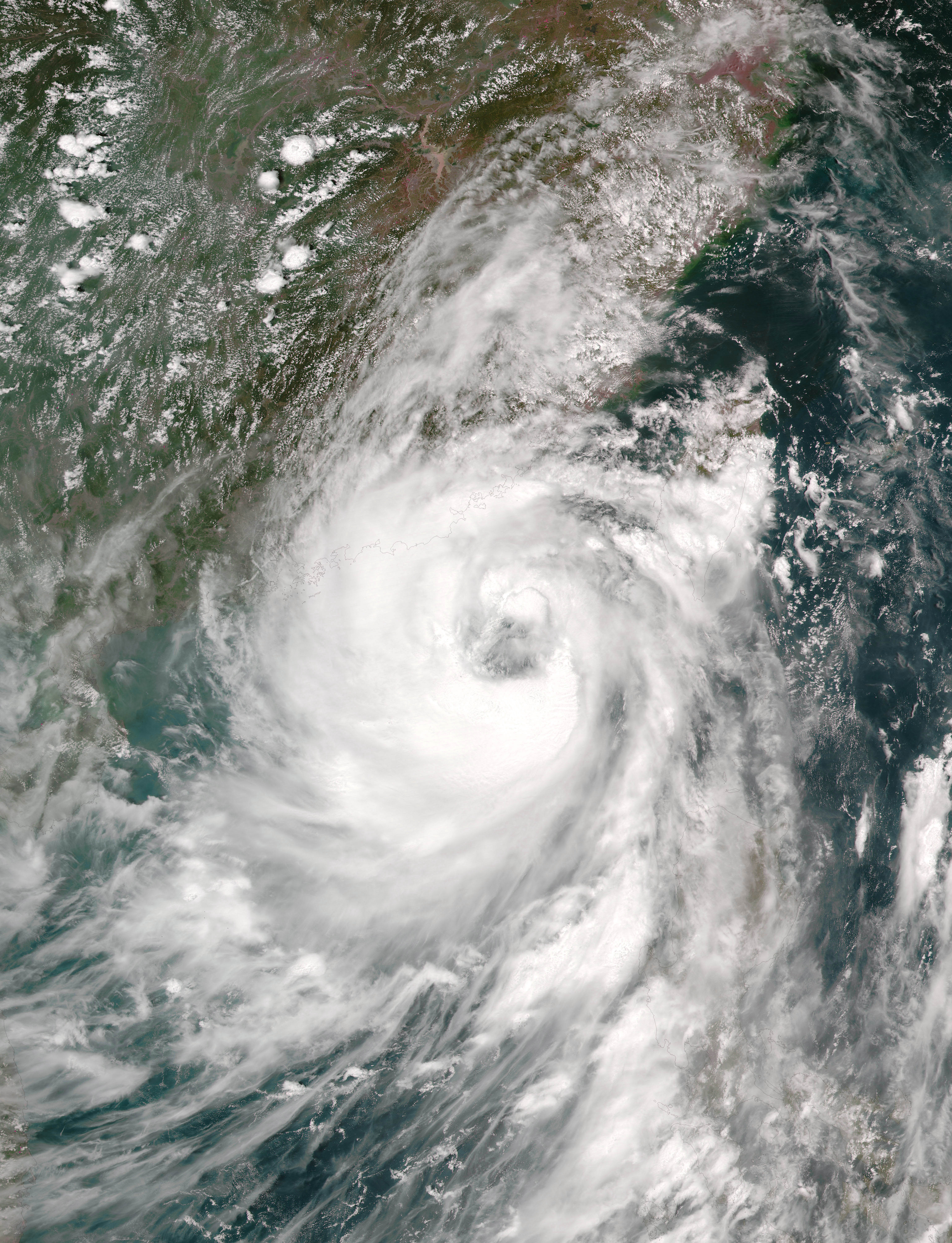 This August 1, 2016 NASA satellite imag shows Typhoon Nida approaching China. Hong Kong hunkered down August 1 as Typhoon Nida swirled towards it, with more than 100 flights cancelled and schools closed, and Guangzhou in neighbouring mainland China issued its top storm alert. Hong Kong was expected to raise a "T8" storm signal -- the third-highest -- Monday evening as the storm edged closer to the city, packing winds of 120 kilometres (75 miles) per hour.  / AFP PHOTO / NASA / Handout / RESTRICTED TO EDITORIAL USE - MANDATORY CREDIT "AFP PHOTO / NASA" - NO MARKETING - NO ADVERTISING CAMPAIGNS - DISTRIBUTED AS A SERVICE TO CLIENTS