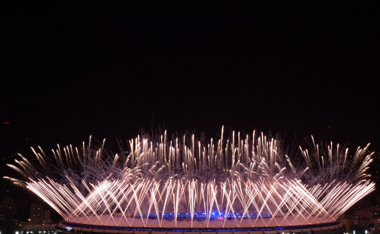 Fireworks explode over the Maracana stadium during the opening ceremony of the Rio 2016 Olympic Games in Rio de Janeiro on August 5, 2016. / AFP PHOTO / Andrej ISAKOVIC