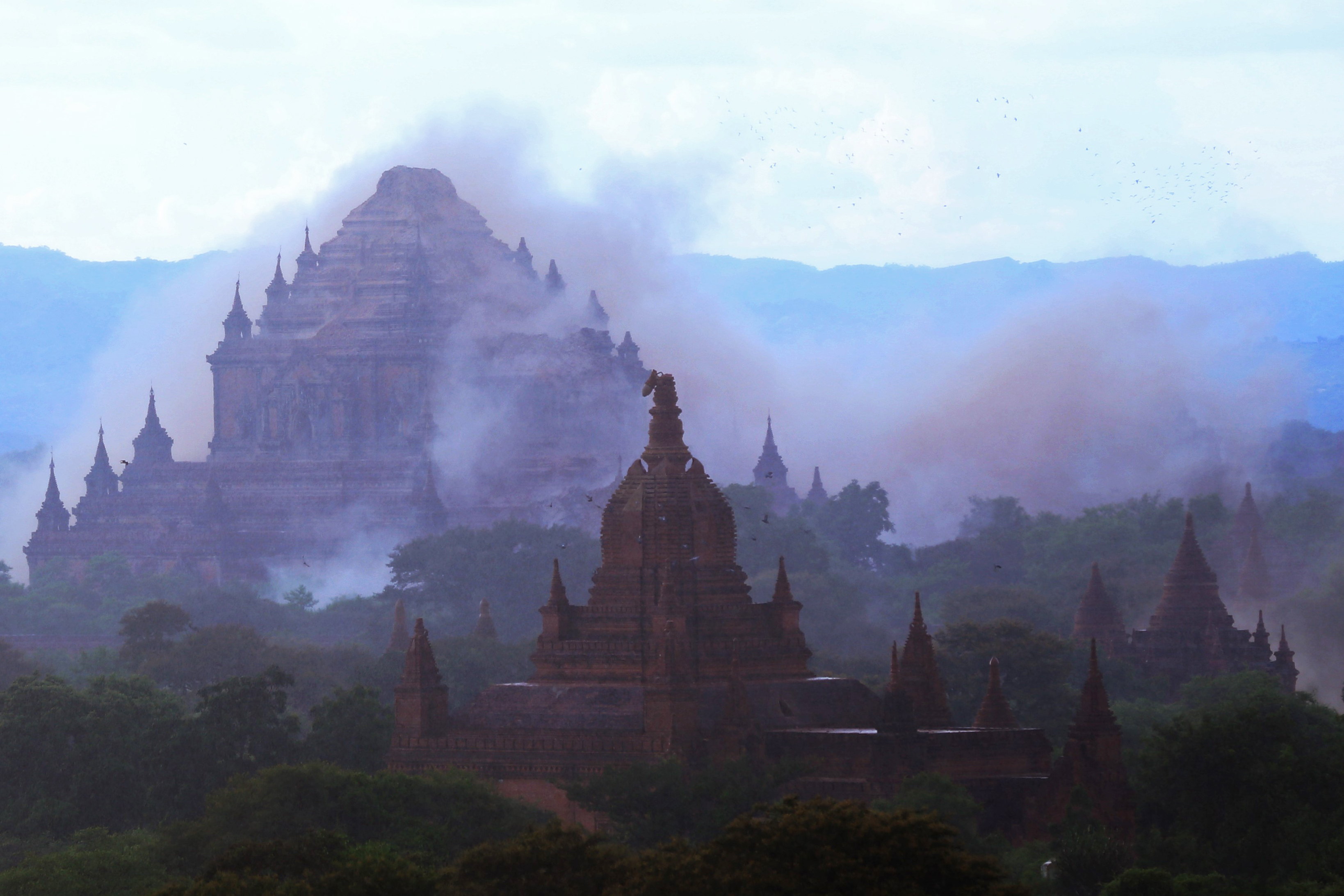 The ancient Sulamuni temple is seen shrouded in dust as a 6.8 magnitude earthquake hit Bagan on August 24, 2016. A powerful 6.8 magnitude earthquake struck central Myanmar on August 24, killing at least one person and damaging pagodas in the ancient city of Bagan, officials said. The quake, which the US Geological Survey said hit at a depth of 84 kilometres (52 miles), was also felt across neighbouring Thailand, India and Bangladesh, sending panicked residents rushing onto the streets. / AFP PHOTO / SOE MOE AUNG / The erroneous mention[s] appearing in the metadata of this photo by SOE MOE AUNG has been modified in AFP systems in the following manner: [Sulamuni] instead of [Dhammayangyi temple ]. Please immediately remove the erroneous mention[s] from all your online services and delete it (them) from your servers. If you have been authorized by AFP to distribute it (them) to third parties, please ensure that the same actions are carried out by them. Failure to promptly comply with these instructions will entail liability on your part for any continued or post notification usage. Therefore we thank you very much for all your attention and prompt action. We are sorry for the inconvenience this notification may cause and remain at your disposal for any further information you may require.