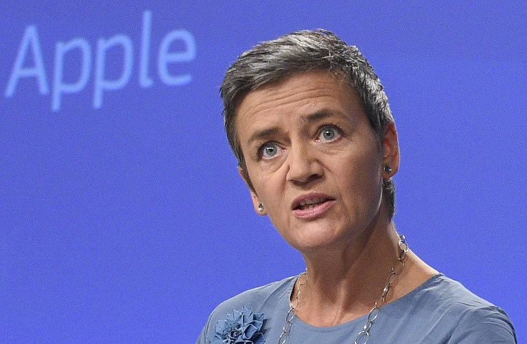 EU Competition Commissioner Margrethe Vestager talks as she gives a press conference to order Apple to pay 13 billion euros in back taxes, in Brussels on August 30, 2016.  The European Union on August 30, 2016, ordered Apple to pay a record 13 billion euros in back taxes in Ireland, saying deals allowing the US tech giant to pay almost no tax were illegal. Apple and the Irish government immediately said they would appeal against the European Commission ruling, while the US Treasury said it could undermine its economic partnership with the EU. Ireland has been seeking to attract multinationals by offering extremely favourable tax conditions, known as sweetheart deals, but EU Competition Commissioner Margrethe Vestager said Apple's broke EU laws on state aid.  / AFP PHOTO / John THYS