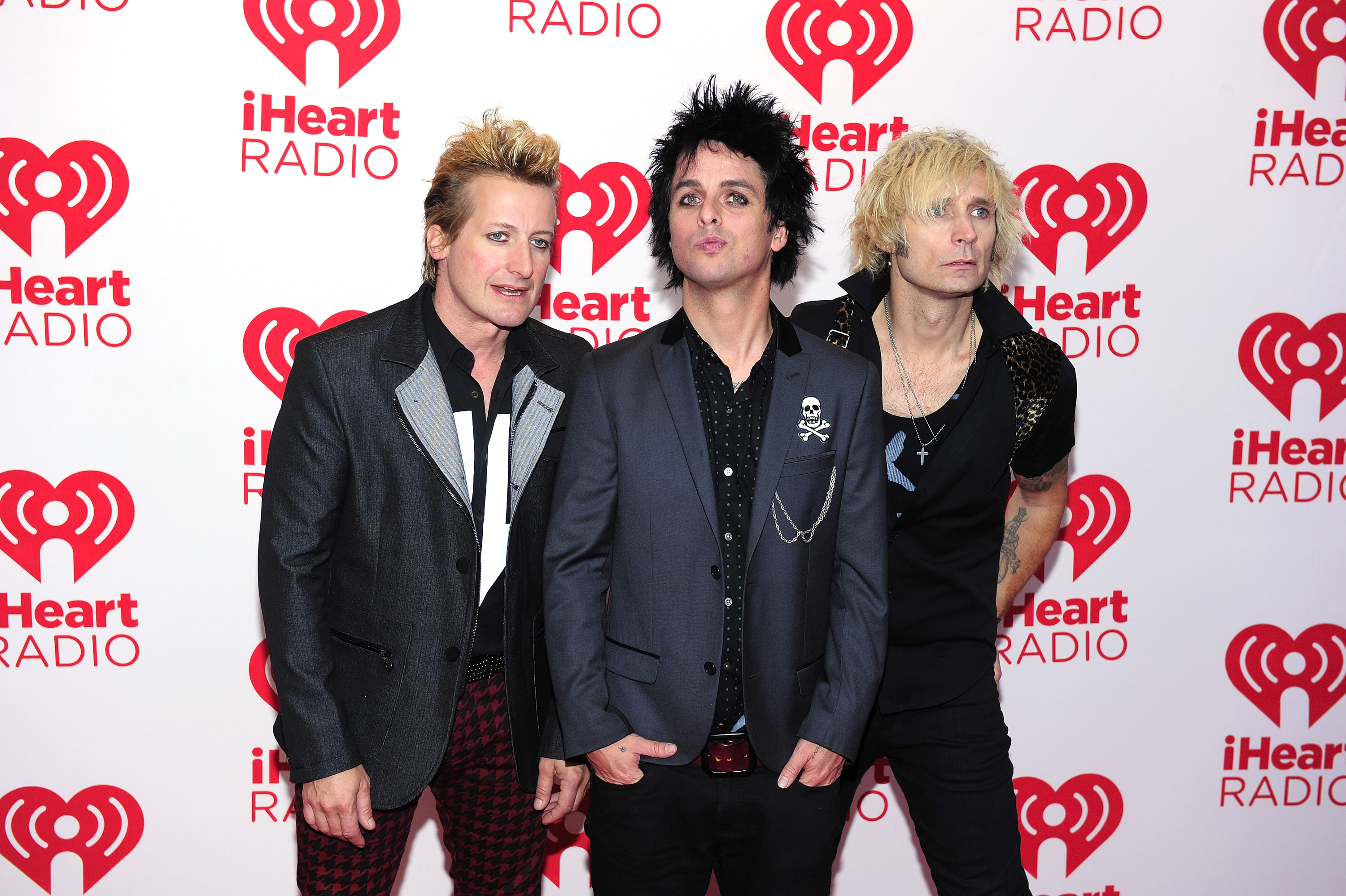 LAS VEGAS, NV - SEPTEMBER 21: (L-R) Drummer Tre Cool, frontman Billie Joe Armstrong and bassist Mike Dirnt of the band Green Day pose in the press room at the iHeartRadio Music Festival at the MGM Grand Garden Arena September 21, 2012 in Las Vegas, Nevada. Steven Lawton/Getty Images/AFP