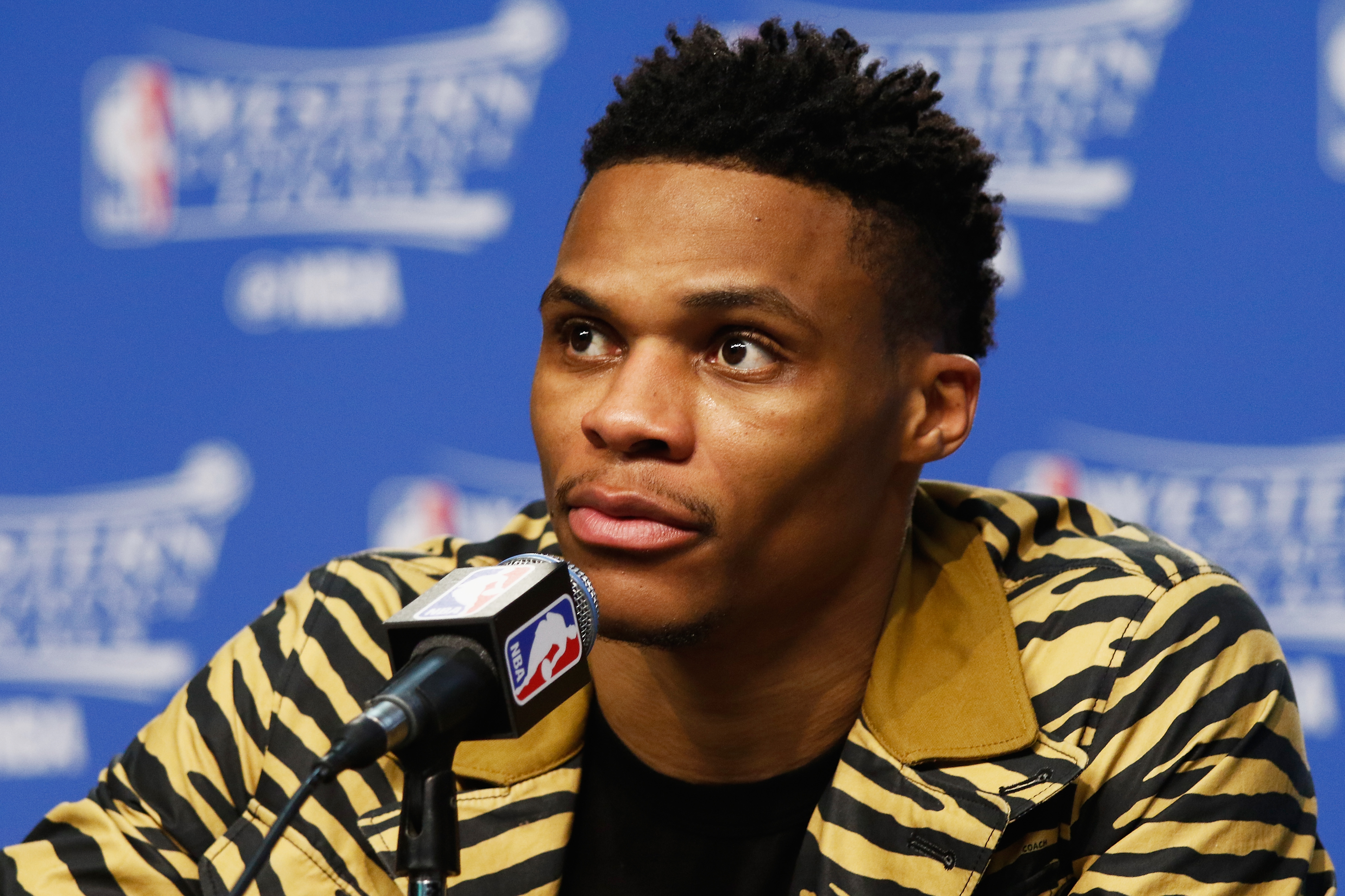 OKLAHOMA CITY, OK - MAY 28: Russell Westbrook #0 of the Oklahoma City Thunder looks on during a press conference after the Golden State Warriors defeated the Oklahoma City Thunder 108-101 in game six of the Western Conference Finals during the 2016 NBA Playoffs at Chesapeake Energy Arena on May 28, 2016 in Oklahoma City, Oklahoma. NOTE TO USER: User expressly acknowledges and agrees that, by downloading and or using this photograph, User is consenting to the terms and conditions of the Getty Images License Agreement.   J Pat Carter/Getty Images/AFP