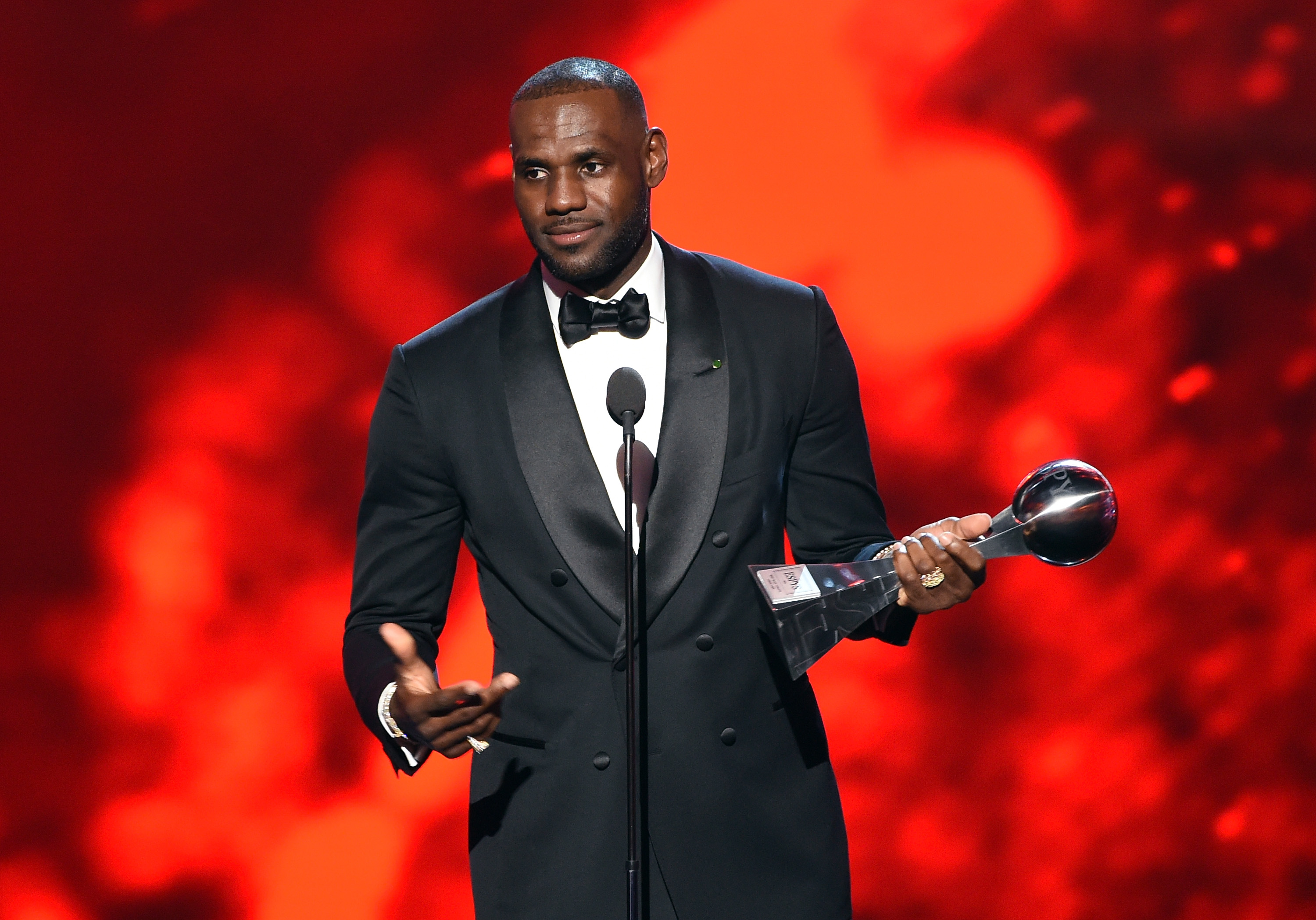 LOS ANGELES, CA - JULY 13: NBA player LeBron James accepts the Best Male Athlete award onstage during the 2016 ESPYS at Microsoft Theater on July 13, 2016 in Los Angeles, California.   Kevin Winter/Getty Images/AFP