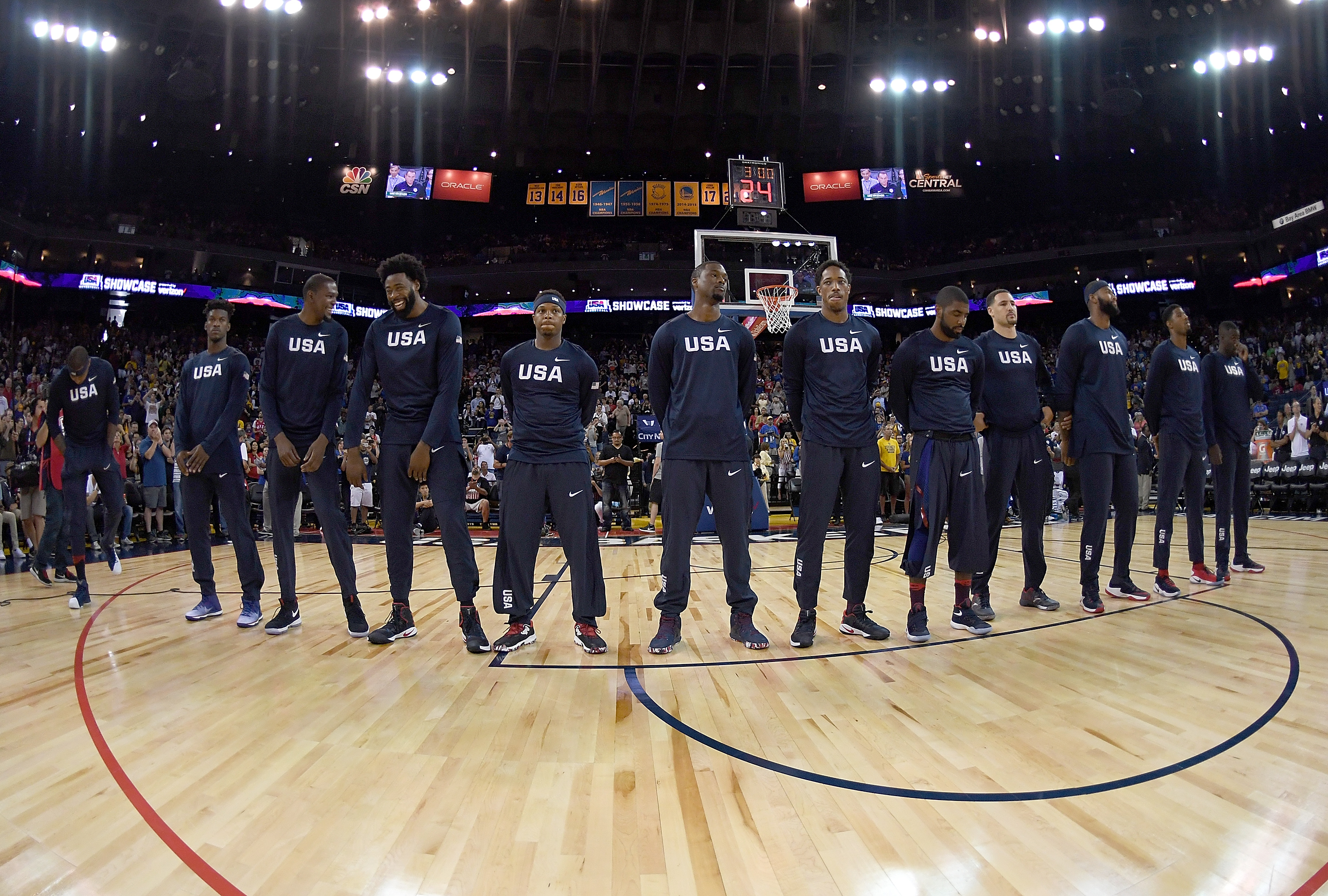 OAKLAND, CA - JULY 26: The United States Men's National Basketball Team stands together during the playing of the National Anthem prior to playing the China Men's National Team in a USA Basketball showcase exhibition game at ORACLE Arena on July 26, 2016 in Oakland, California. Thearon W. Henderson/Getty Images/AFP