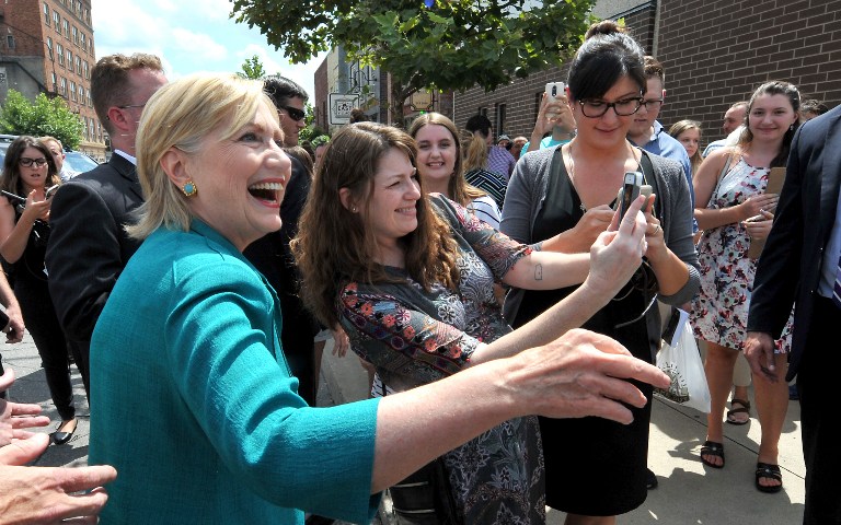 DES MOINES, IA Ð AUGUST 10: Democratic presidential nominee Hillary Clinton stepped outside to greet supporters after he talk at a screen print shop where she talked about her economic plan, August 10, 2016 in Des Moines, Iowa. It was Clinton's first trip back to Iowa since winning the Iowa Caucus. Steve Pope/Getty Images/AFP