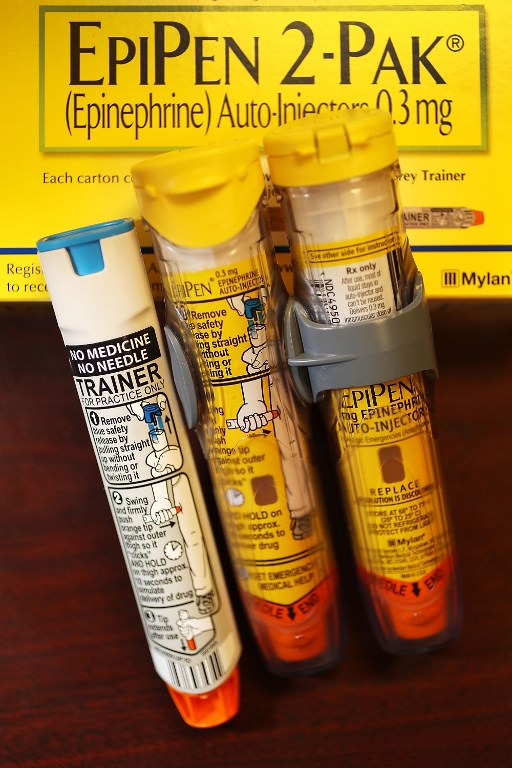 HOLLYWOOD, FL - AUGUST 24: In this photo illustration, EpiPen, which dispenses epinephrine through an injection mechanism for people with severe allergies, is seen as the company that makes it Mylan Inc. has come under fire from consumers and lawmakers for the price that it is currently charging on August 16, 2016 in Hollywood, Florida. Reports indicate that the cost of a pair of EpiPens has risen 400 percent from when the Mylan acquired the original company in 2007. (Photo Illustration by Joe Raedle/Getty Images)