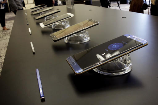 In this July 28, 2016, photo, the Galaxy Note 7, foreground, is displayed in New York. Samsung releases an update to its jumbo smartphone and virtual-reality headset, mostly with enhancements rather than anything revolutionary during a preview of Samsung products. (AP Photo/Richard Drew)