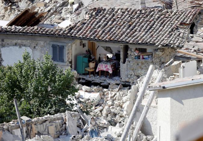 The interior of a damaged house is seen following an earthquake at Pescara del Tronto, central Italy, August 26, 2016. REUTERS/Max Rossi