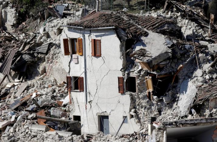 A collapsed house is seen following an earthquake at Pescara del Tronto, central Italy, August 26, 2016. REUTERS/Max Rossi