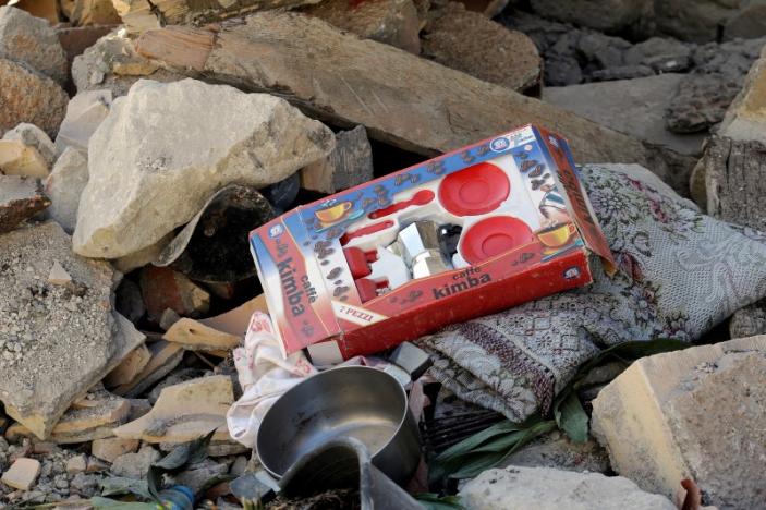 A coffee toy kit is seen on debris outside a damaged house, following an earthquake in Pescara del Tronto, central Italy August 26, 2016. REUTERS/Max Rossi