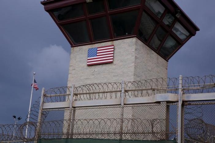 The United States flag decorates the side of a guard tower inside of Joint Task Force Guantanamo Camp VI at the U.S. Naval Base in Guantanamo Bay, Cuba March 22, 2016. REUTERS/Lucas Jackson/File Photo