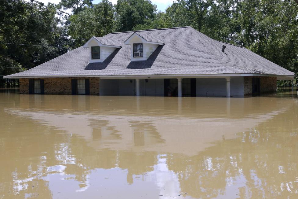 A submerged house is seen in Ascension Parish, Louisiana. REUTERS/Jonathan Bachman