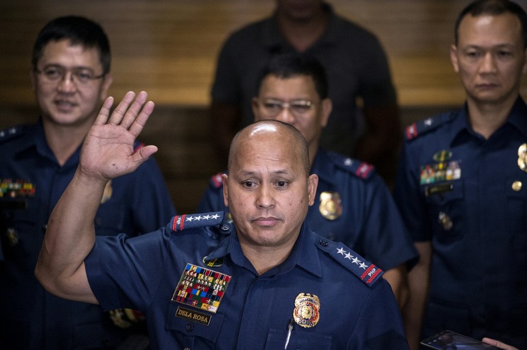 (File photo) Philippine National Police (PNP) chief director general Ronald Dela Rosa (front) gestures as he speaks during a press conference at PNP headquarters in Manila on July 6, 2016. / AFP PHOTO / NOEL CELIS