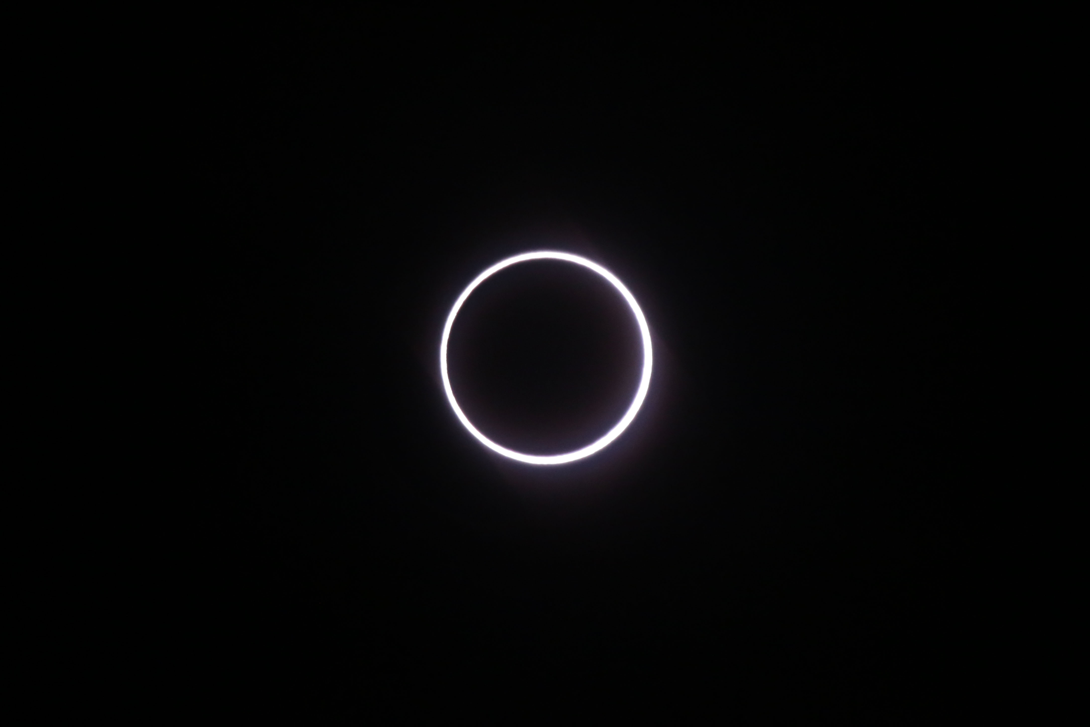 Photo taken on September 1, 2016, in Saint-Louis, on the Indian Ocean island of La Reunion, shows the moon covering the sun, leaving a ring of fire effect around the moon, during an annular solar eclipse. Stargazers in south and central Africa were treated to a spectacular solar eclipse on September 1, 2016 when the Moon wanders into view to make the Sun appear as a "ring of fire", astronomers say. The phenomenon, known as an annular solar eclipse, happens when there is a near-perfect alignment of the Earth, Moon and Sun. But unlike a total eclipse, when the Sun is blacked out, sometimes the Moon is too far from Earth, and its apparent diameter too small, for complete coverage.  / AFP PHOTO / Richard BOUHET