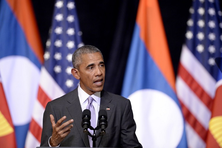 US President Barack Obama gestures as he delivers a speech about US-Laos relations at the Lao National Cultural Hall in Vientiane on September 6, 2016. Obama became the first US president to visit Laos in office, touching down in Vientiane late on September 5 for a summit of East and South East Asian leaders. / AFP PHOTO / NOEL CELIS