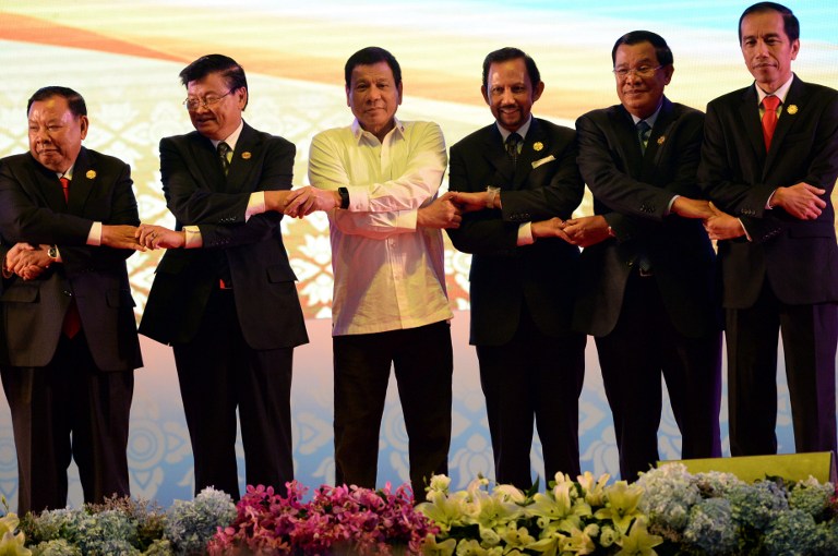 From L-R: Vietnam's Prime Minister Nguyen Xuan Phuc, Laos Prime Minister Thongloun Sisoulith, Philippine President Rodrigo Duterte, Brunei's Sultan Hassanal Bolkiah, Cambodia's Prime Minister Hun Sen, and Indonesia's President Joko Widodo attend the opening ceremony of the Association of Southeast Asian Nations (ASEAN) Summit in Vientiane on September 6, 2016. The gathering will see the 10 ASEAN members meet by themselves, then with leaders from the US, Japan, South Korea and China. / AFP PHOTO / ROSLAN RAHMAN