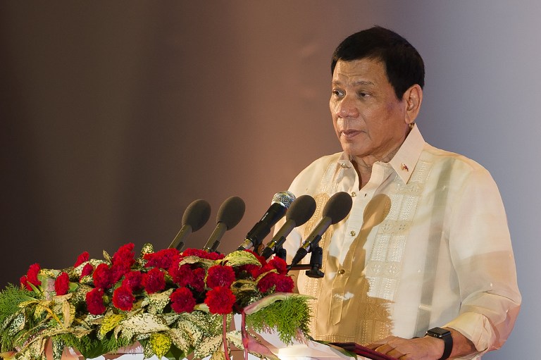 Philippine President Rodrigo Duterte speaks during the closing ceremony of the Association of Southeast Asian Nations (ASEAN) and handover of the ASEAN chairmanship to the Philippines in Vientiane on September 8, 2016. ASEAN leaders gather in Vientiane for the 28th and 29th ASEAN Summits held between September 6 to 8. / AFP PHOTO / YE AUNG THU