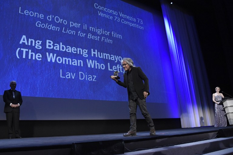 Director Lav Diaz holds the Golden Lion award for Best Film for the movie "The Woman Who Left"  during the awards ceremony of the 73rd Venice Film Festival on September 10, 2016 at Venice Lido.  / AFP PHOTO / TIZIANA FABI
