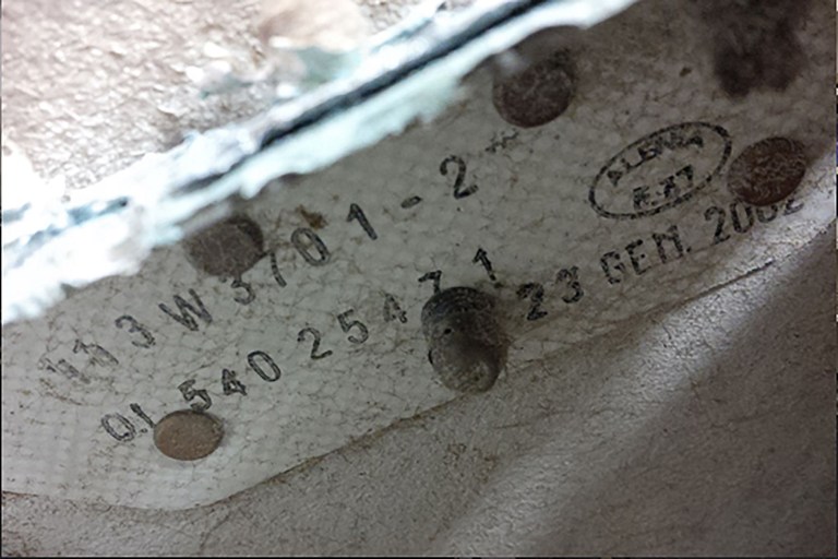 An undated handout photo released by the Australian Transport Safety Board (ATSB) and received on September 15, 2016, shows part number information on a large piece of debris found in Tanzania recently which has been confirmed as a part of a wing flap from missing Malaysia Airlines passenger jet MH370. The outboard flap is the fifth piece of the plane to be identified by experts in Canberra since the first bit of debris  from MH370 -- a two-metre (almost seven-foot) wing part known as a flaperon -- was found on the French Indian Ocean island of Reunion in July 2015. / AFP PHOTO / ATSB / Handout / RESTRICTED TO EDITORIAL USE - MANDATORY CREDIT "AFP PHOTO / AUSTRALIAN TRANSPORT SAFETY BOARD" - NO MARKETING NO ADVERTISING CAMPAIGNS - DISTRIBUTED AS A SERVICE TO CLIENTS == NO ARCHIVE