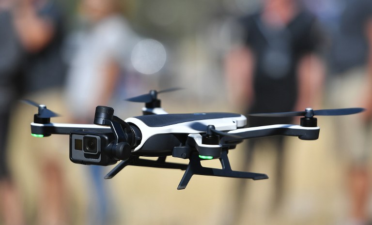 A new GoPro Karma foldable drone is seen flying during a press event in Olympic Valley, California on September 19, 2016.  / AFP PHOTO / JOSH EDELSON