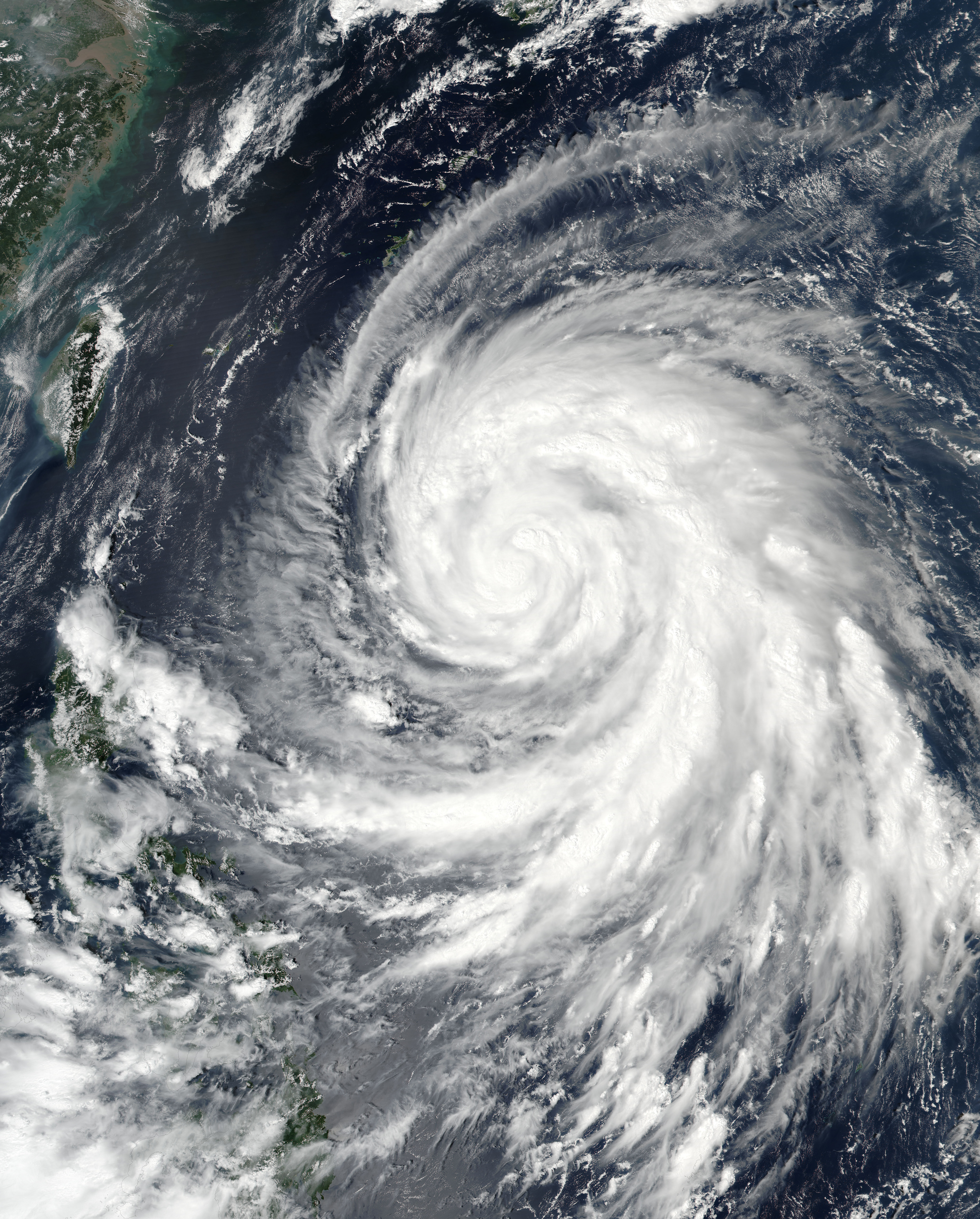 This September 25, 2016 NASA satellite image shows Typhoon Megi (20W) in the western Pacific. Typhoon Megi will continue to strengthen through Monday before threatening lives and property across Taiwan and eastern China this week. As of 2 p.m. local September 25, Typhoon Megi was centered 1,040 kilometers east-southeast of Eluanbi on Taiwan's southernmost tip and was moving in a west-northwest direction at a speed of 23 kph, with gusts reaching 137 kph, according to Taiwan's Central Weather Bureau.  / AFP PHOTO / NASA / HO / RESTRICTED TO EDITORIAL USE - MANDATORY CREDIT "AFP PHOTO / NASA" - NO MARKETING - NO ADVERTISING CAMPAIGNS - DISTRIBUTED AS A SERVICE TO CLIENTS