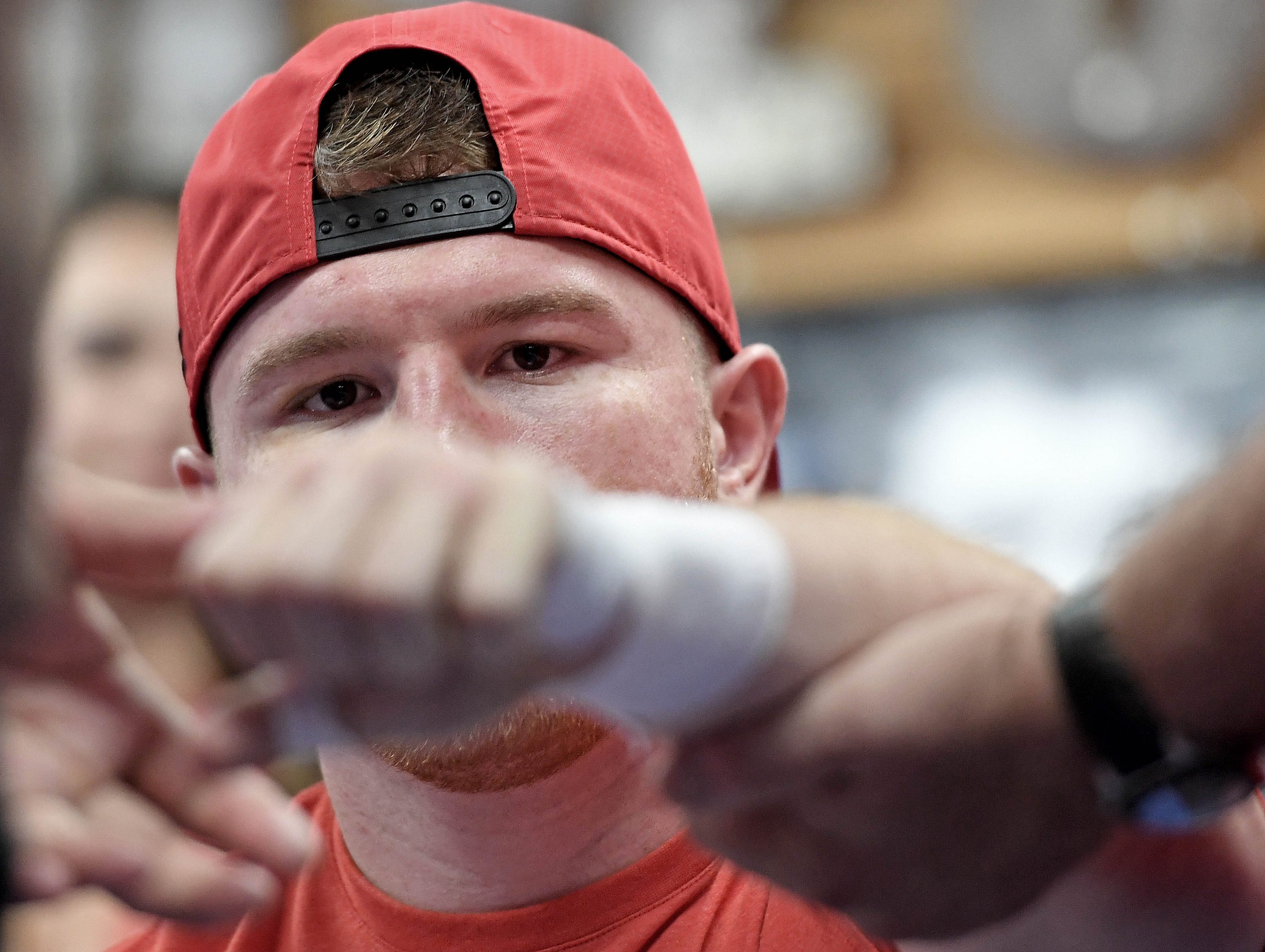 SAN DIEGO, CA - AUGUST 31: Boxer Canelo Alvarez of Mexico has his hands taped up during his Open Workout at the House of Boxing on August 31, 2016 in San Diego, California. Canelo Alvarez fights Liam Smith of Great Britain for the WBO Junior Middleweight World Championship on September 17, 2016 in Arlington, Texas.   Donald Miralle/Getty Images/AFP