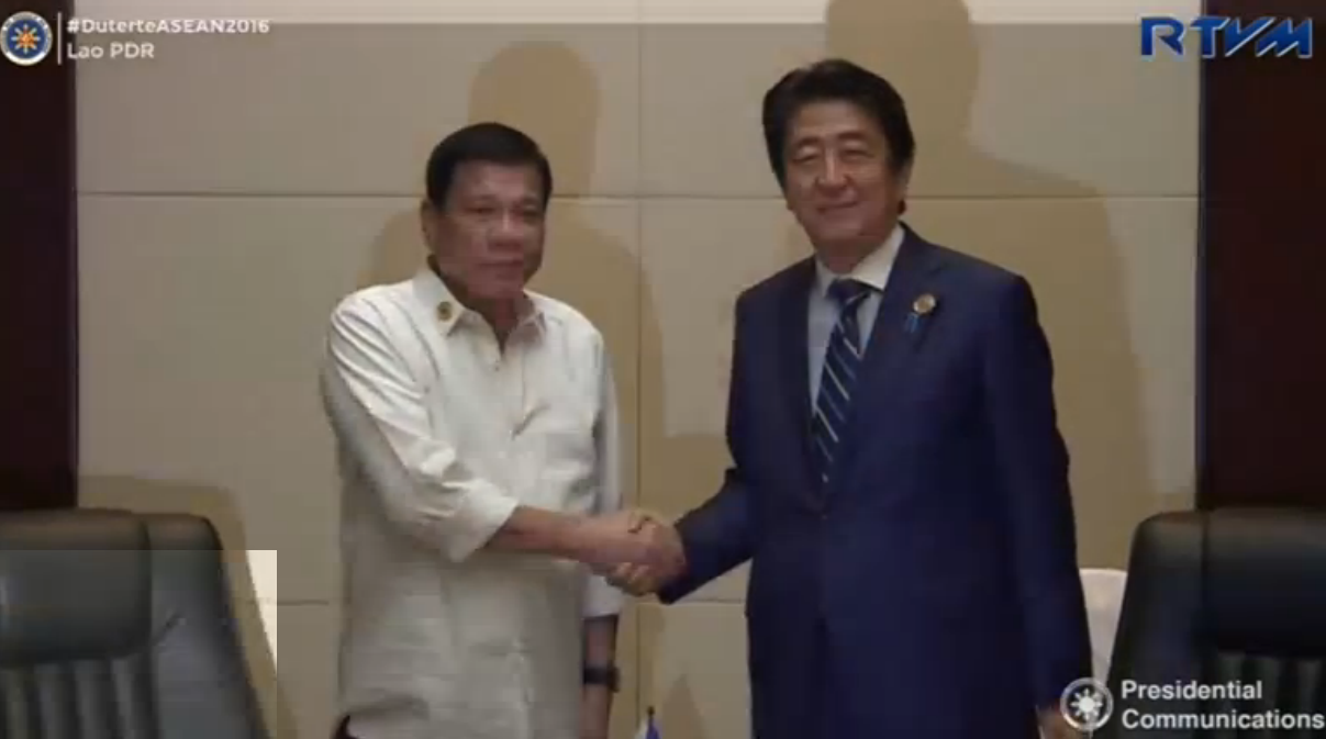 The President of the Philippines, Rodrigo Duterte, meets his Japanese and Vietnamese counterparts on the sidelines of a regional meeting in Laos, agreeing to step up cooperation to ensure a peaceful solution in the South China Sea. (Courtesy Reuters/Photo grabbed from Reuters video)