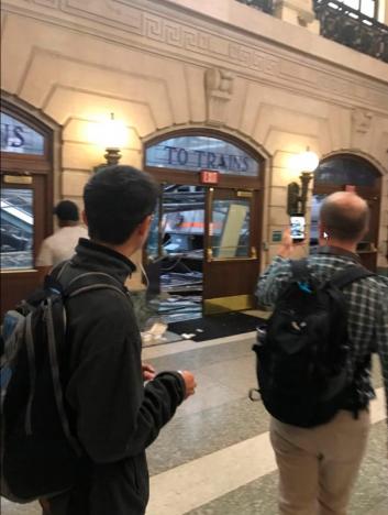 Onlookers view a New Jersey Transit train that derailed and crashed through the station in Hoboken, New Jersey, U.S. in this picture courtesy of David Richman taken September 29, 2016. Courtesy of David Richman via REUTERS