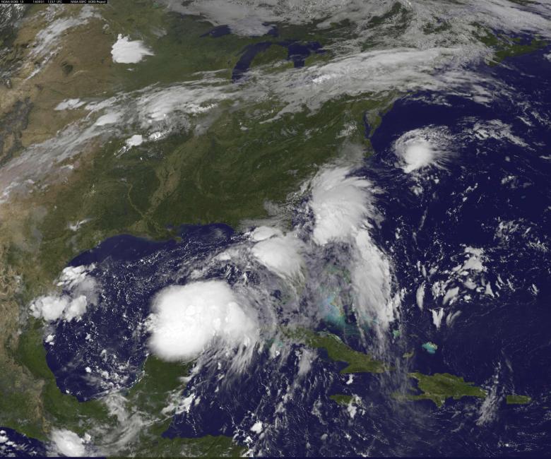 Two Tropical Depressions are shown over the Gulf of Mexico and along the Carolina coast of the United States in this GOES East satellite image captured August 31, 2016.  NOAA/Handout via REUTERS