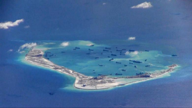 FILE PHOTO - Chinese dredging vessels are purportedly seen in the waters around Mischief Reef in the disputed Spratly Islands in the South China Sea in this still image from video taken by a P-8A Poseidon surveillance aircraft provided by the United States Navy May 21, 2015. U.S. Navy/Handout via Reuters/File Photo