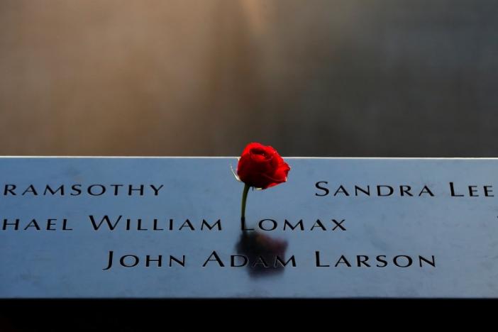 A rose is placed on a name on the memorial at the National September 11 Memorial and Museum in Lower Manhattan in New York City, U.S., September 9, 2016. REUTERS/Brendan McDermid