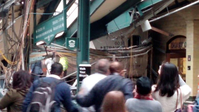Onlookers view a New Jersey Transit train that derailed and crashed through the station in Hoboken, New Jersey, U.S. in this picture courtesy of Chris Lantero taken September 29, 2016. Courtesy of Chris Lantero via REUTERS