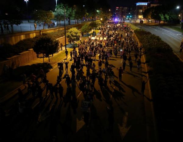 Demonstrators march outside the downtown streets protesting the police shooting of Keith Scott in Charlotte, North Carolina, U.S., September 24, 2016. REUTERS/Mike Blake