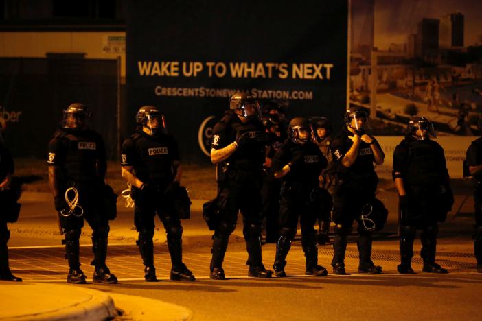 Police monitor marchers protesting the police shooting of Keith Scott in Charlotte, North Carolina, U.S. September 24, 2016. REUTERS/Jason Miczek