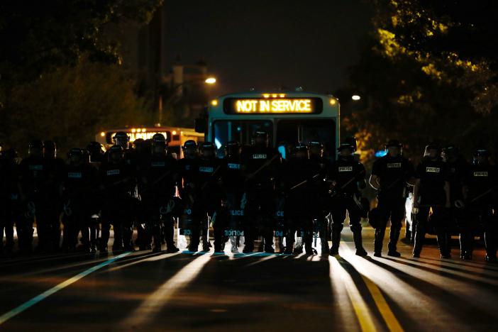 Riot police assemble to enforce a curfew as marchers protest the police shooting of Keith Scott in Charlotte, North Carolina, U.S., September 24, 2016. REUTERS/Jason Miczek