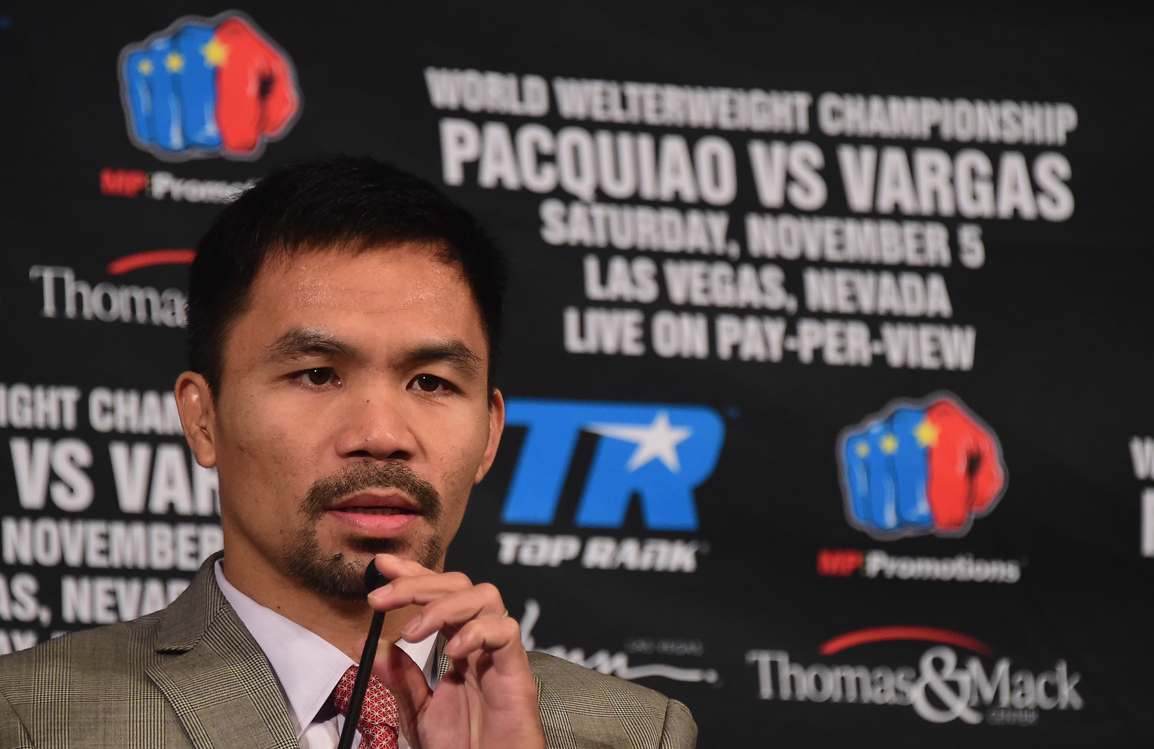 Boxer Manny Pacquiao speaks at a press conference with Jessie Vargas in Beverly Hills, California on September 8, 2016, announcing their November 5th fight. / AFP PHOTO / Frederic J. BROWN