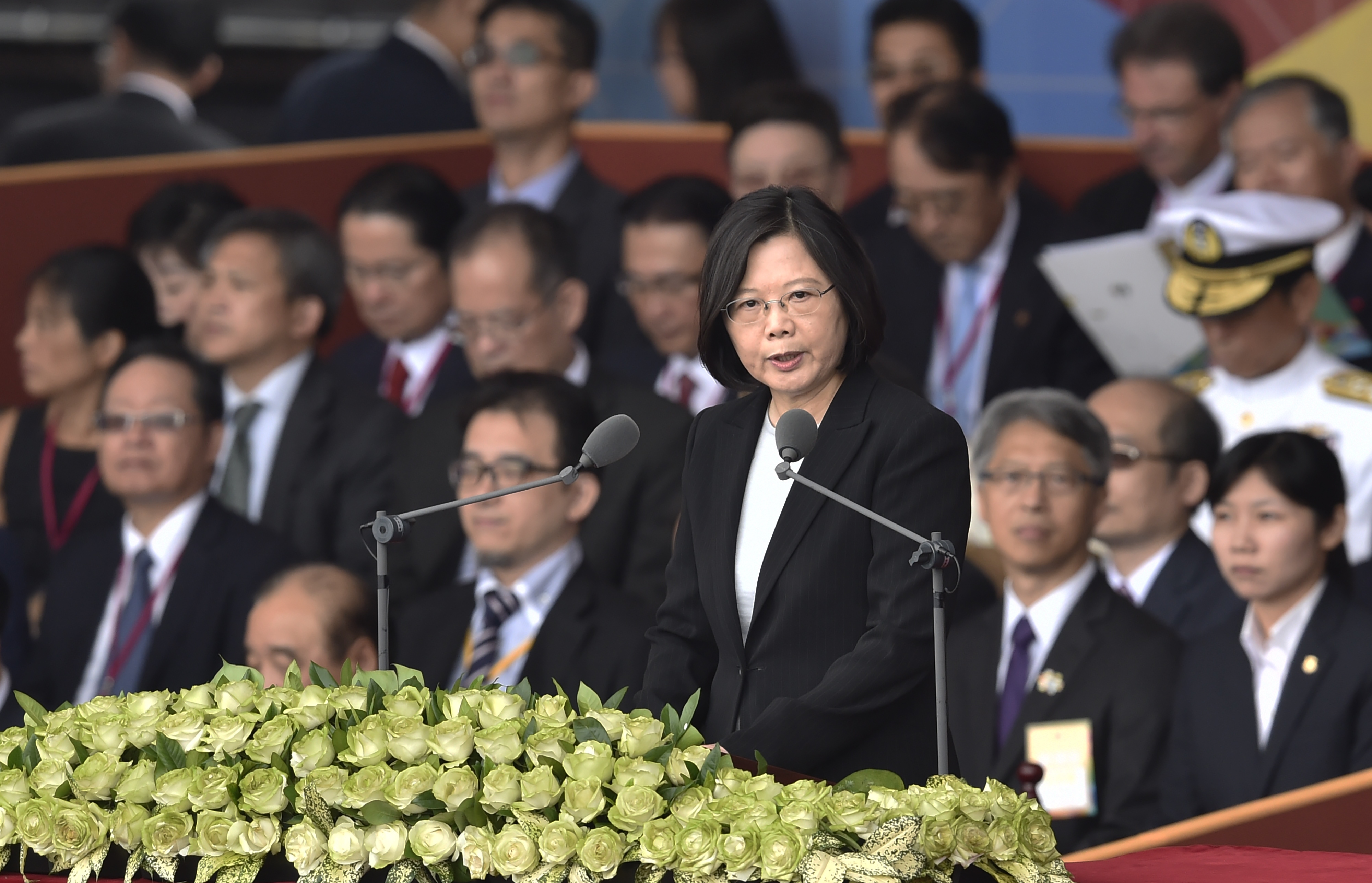 Taiwan President Tsai Ing-wen speaks during National Day celebrations in front of the Presidential Palace in Taipei on October 10, 2016.   Taiwanese President Tsai Ing-wen on October 10 called for a resumption of talks with China and pledged that "anything" can be on the table for discussion. Relations with Beijing have deteriorated under Taiwan's first female president, whose China-sceptic Democratic Progressive Party (DPP) took office in May after a landslide victory over the Kuomintang party (KMT).  / AFP PHOTO / SAM YEH