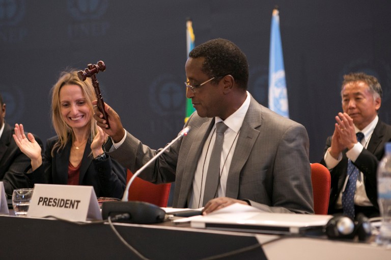 The President of the 28th meeting of the Parties to the Montreal Protocol and Rwanda's minister of Natural Resources Dr Vincent Biruta, hits a hammer as a symbol of the adoption of the Kigali amendment on October 15, 2016 in Kigali. The world community agreed today to phase out a category of dangerous greenhouse gases widely used in refrigerators and air conditioners. Nearly 200 countries agreed to end production and consumption of so-called hydrofluorocarbons (HFCs) under an amendment to the 1987 Montreal Protocol on protecting the ozone layer.  / AFP PHOTO / Cyril NDEGEYA