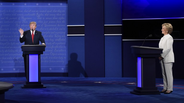 US Republican presidential candidate Donald Trump (L) and US Democratic presidential candidate Hillary Clinton debate during the final presidential debate at the Thomas & Mack Center on the campus of the University of Las Vegas in Las Vegas, Nevada on October 19, 2016. / AFP PHOTO / SAUL LOEB
