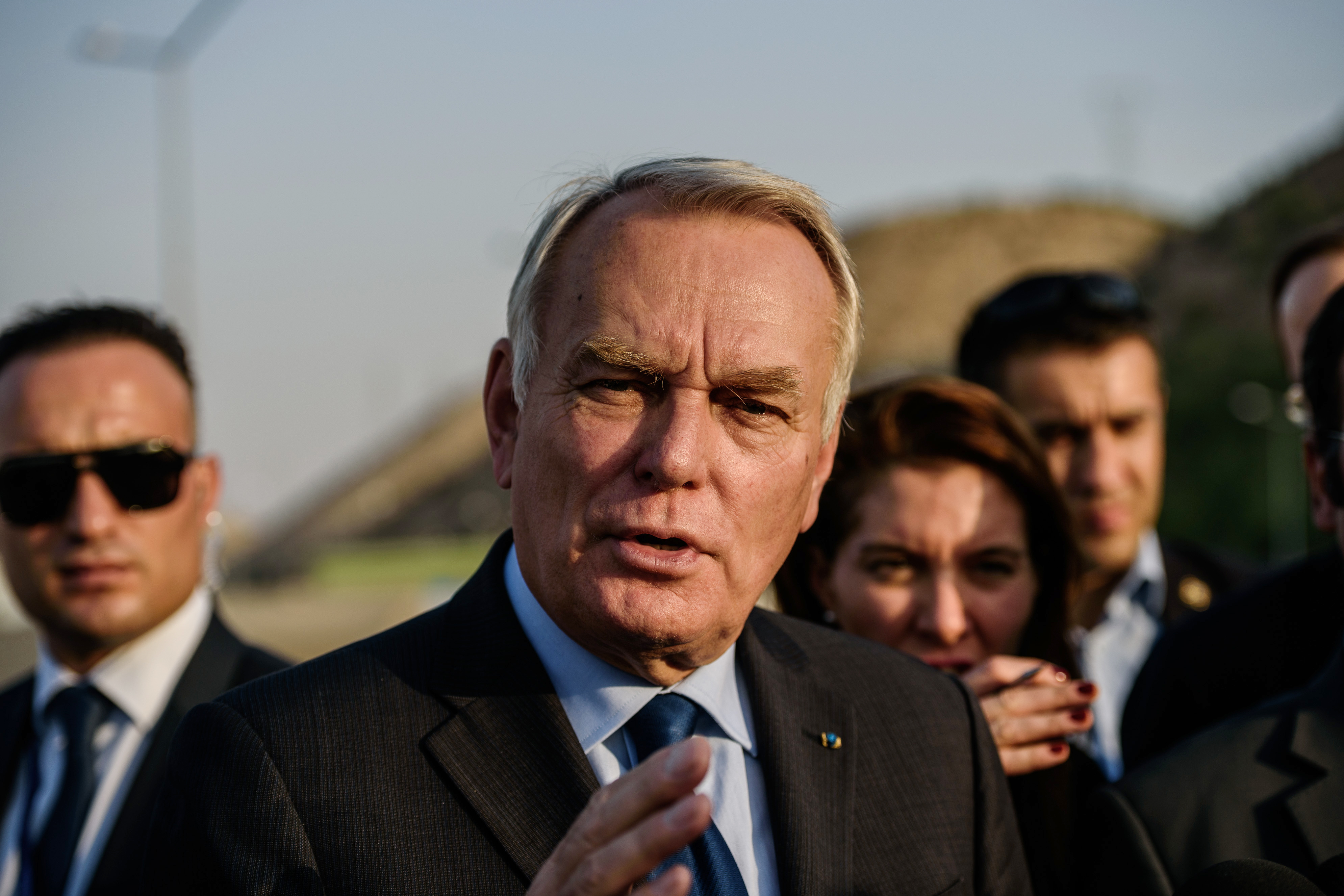 French Foreign Minister Jean-Marc Ayrault speaks to the press during a visit to a refugee camp in the Kilis district of Gaziantep, southeastern Turkey, on October 23, 2016. France's foreign minister urged the international community to "do everything" to end the "massacre" in the Syrian city of Aleppo after fighting resumed following a 72-hour truce declared by Damascus ally Russia. / AFP PHOTO / OZAN KOSE