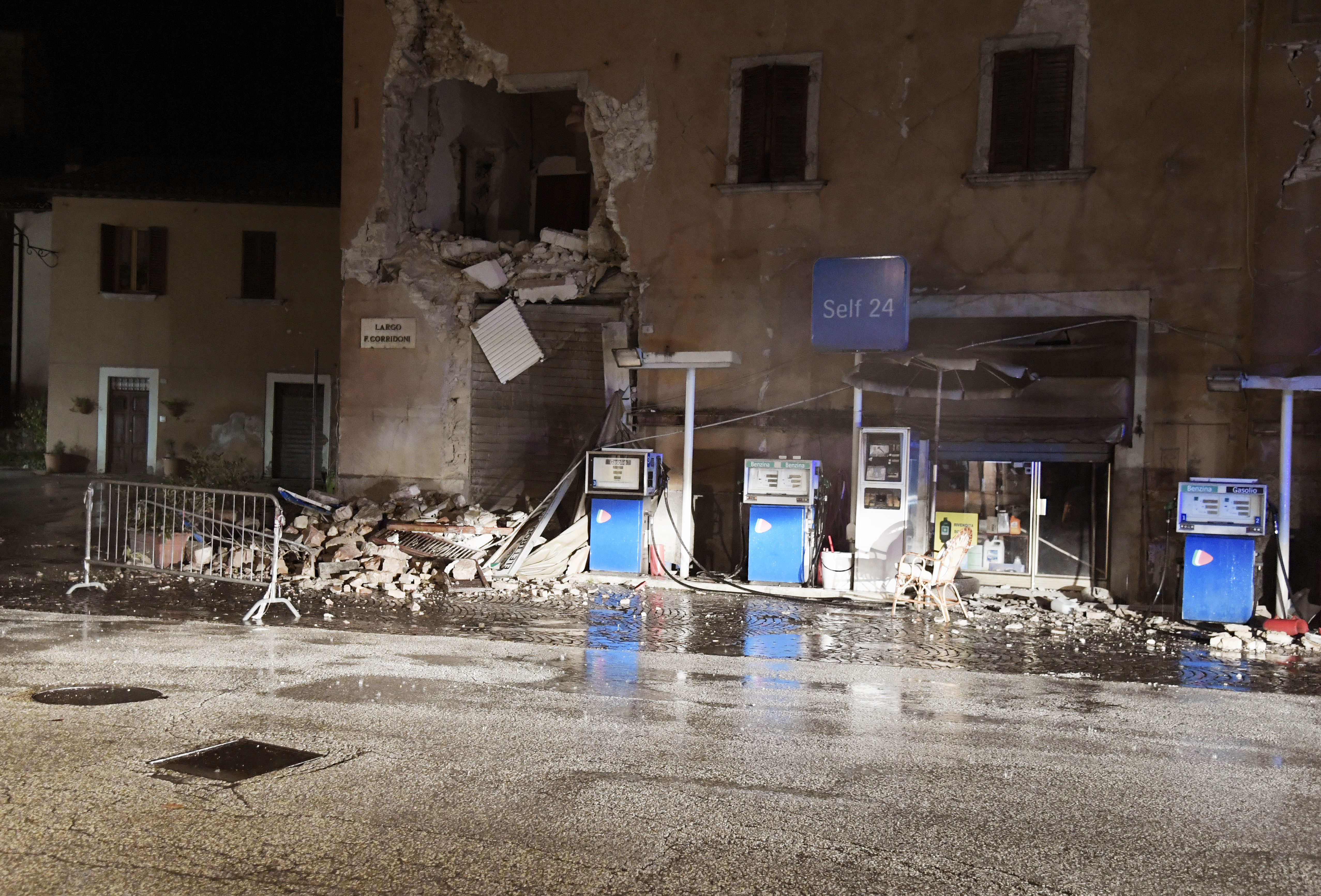 A picture shows a destroyed gas station in the village of Visso, central Italy, after earthquakes on October 26, 2016. Twin earthquakes rocked central Italy on October 26, 2016 -- the second registering at a magnitude of 6.0 -- in the same region struck in August by a devastating tremor that killed nearly 300 people. The quakes were felt in the capital Rome, sending residents running out of their houses and into the streets. The second was felt as far away as Venice in the far north, and Naples, south of the capital. / AFP PHOTO / TIZIANA FABI