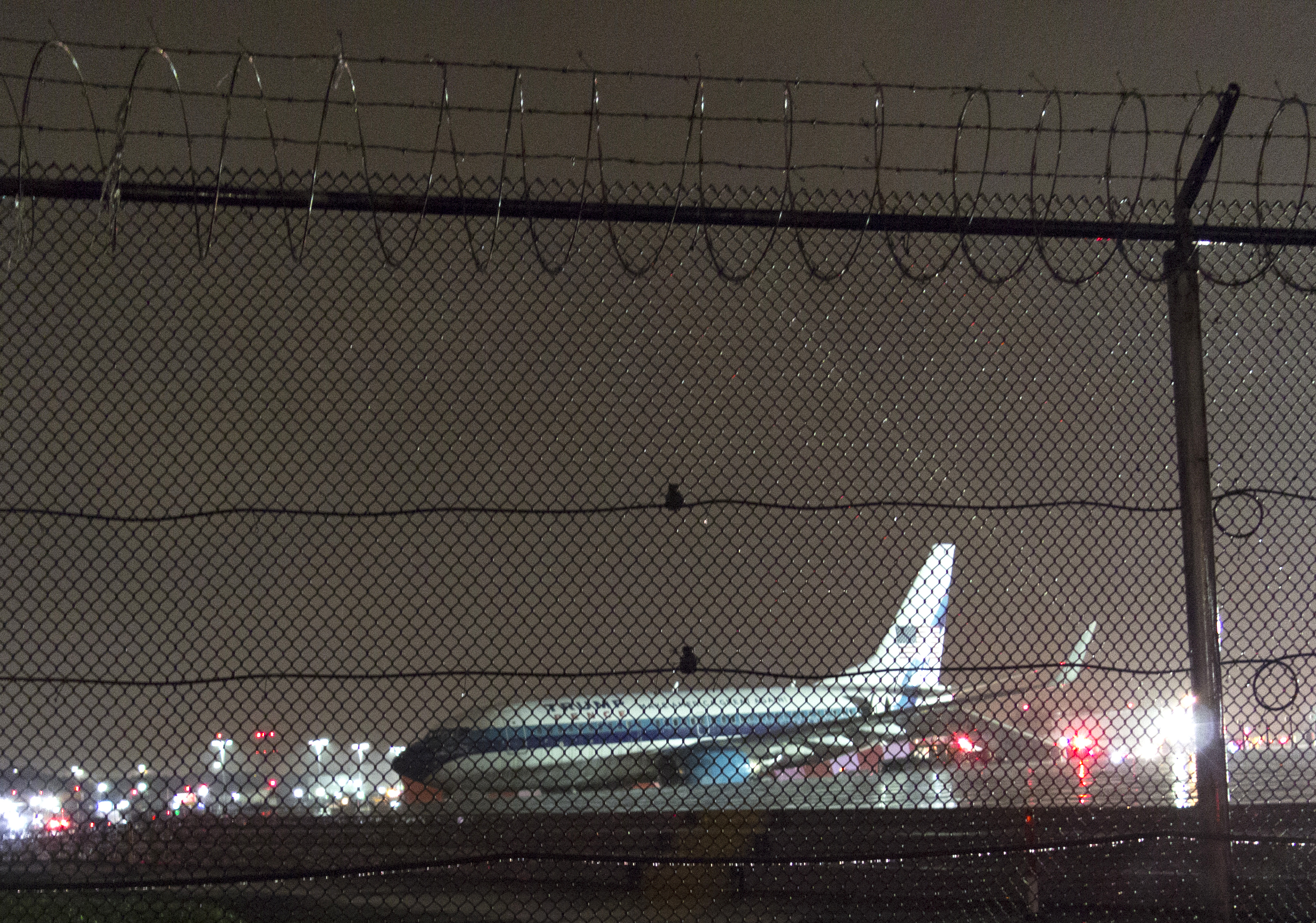 The plane that was carrying Republican vice presidential nominee Mike Pence sits on the runway at New York's LaGuardia Airport October 27, 2016 in New York. Republican vice presidential candidate Mike Pence's campaign plane slid off a runway after landing at New York's LaGuardia Airport in the evening, the campaign said. No injuries were reported. / AFP PHOTO / Don EMMERT