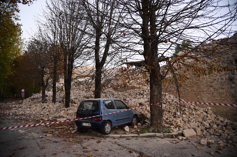 A wall collapsed after a 6.6 magnitude earthquake on October 30, 2016 in Norcia. It came four days after quakes of 5.5 and 6.1 magnitude hit the same area and nine weeks after nearly 300 people died in an August 24 quake that devastated the tourist town of Amatrice at the peak of the holiday season. Italy's most powerful earthquake in 36 years dealt a new blow Sunday to the country's seismically vulnerable heart, sending terrified residents fleeing for the third time in nine weeks and flattening a revered six-century-old church. / AFP PHOTO / FILIPPO MONTEFORTE