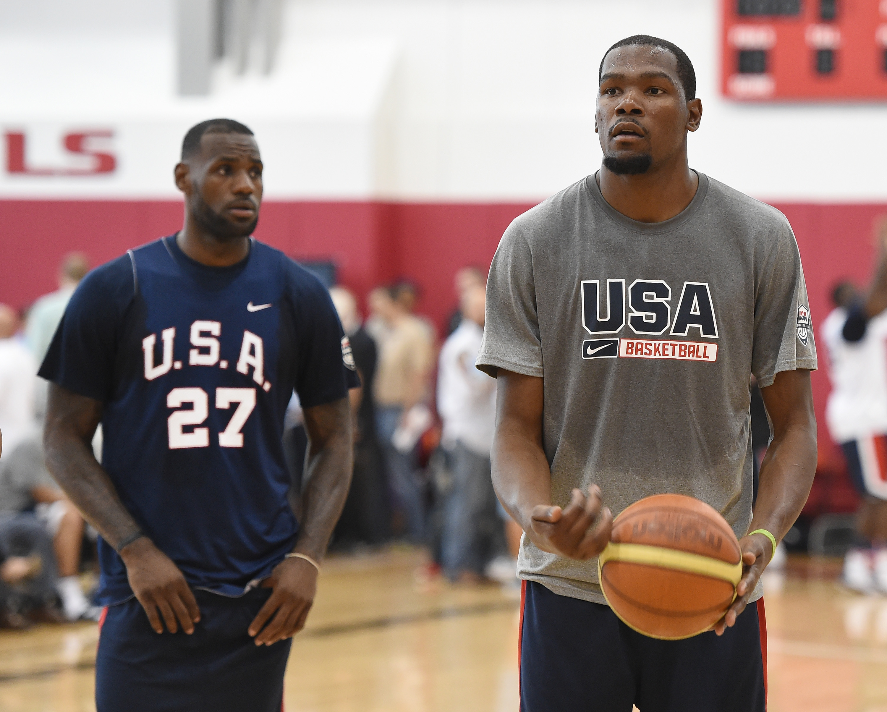 LAS VEGAS, NV - AUGUST 12: LeBron James #27 looks on as Kevin Durant #29 of the 2015 USA Basketball Men's National Team shoots a free throw during a practice session at the Mendenhall Center on August 12, 2015 in Las Vegas, Nevada.   Ethan Miller/Getty Images/AFP