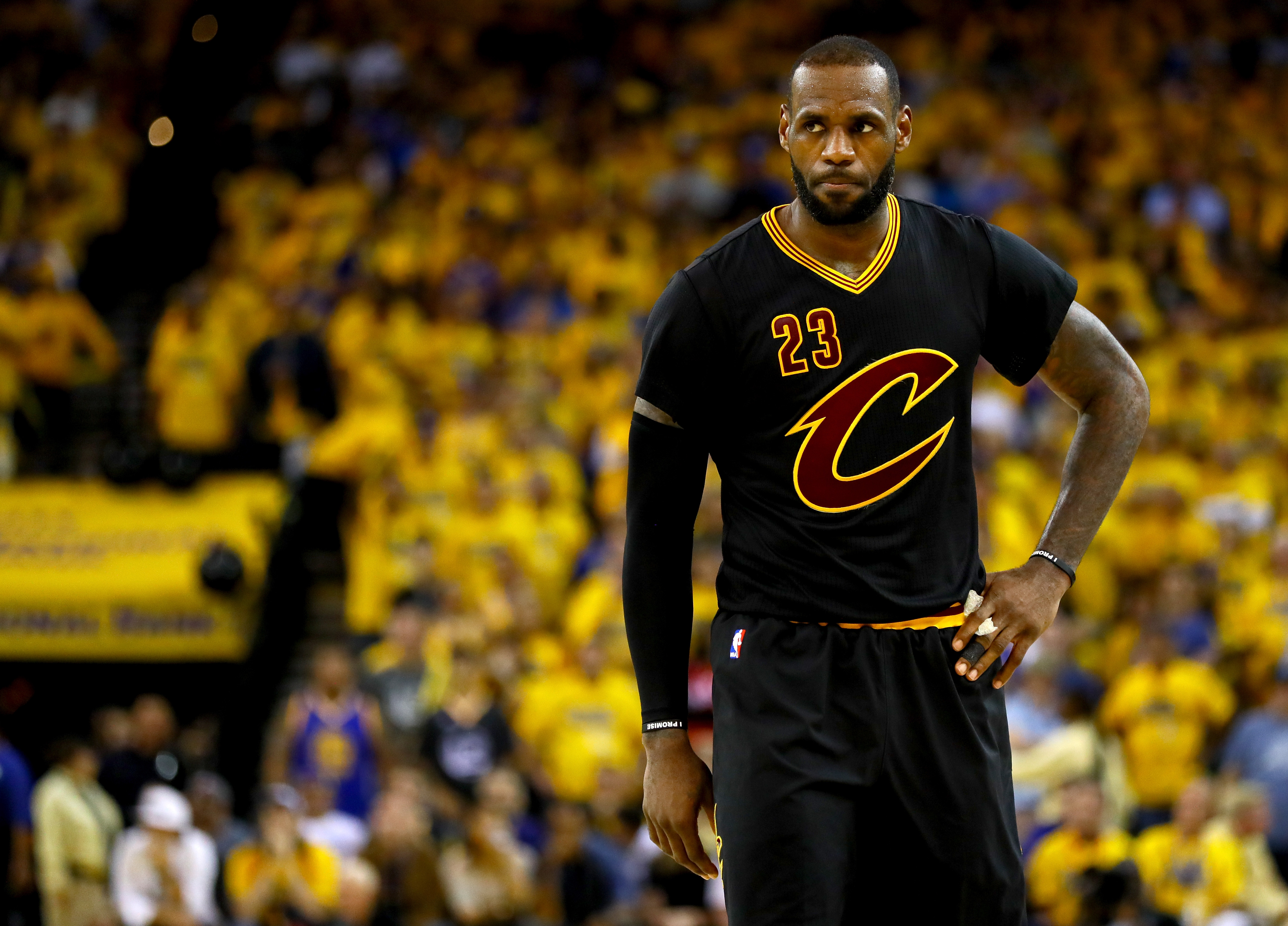 OAKLAND, CA - JUNE 19: LeBron James #23 of the Cleveland Cavaliers reacts to a play in Game 7 of the 2016 NBA Finals against the Golden State Warriors at ORACLE Arena on June 19, 2016 in Oakland, California. NOTE TO USER: User expressly acknowledges and agrees that, by downloading and or using this photograph, User is consenting to the terms and conditions of the Getty Images License Agreement. Ezra Shaw/Getty Images/AFP