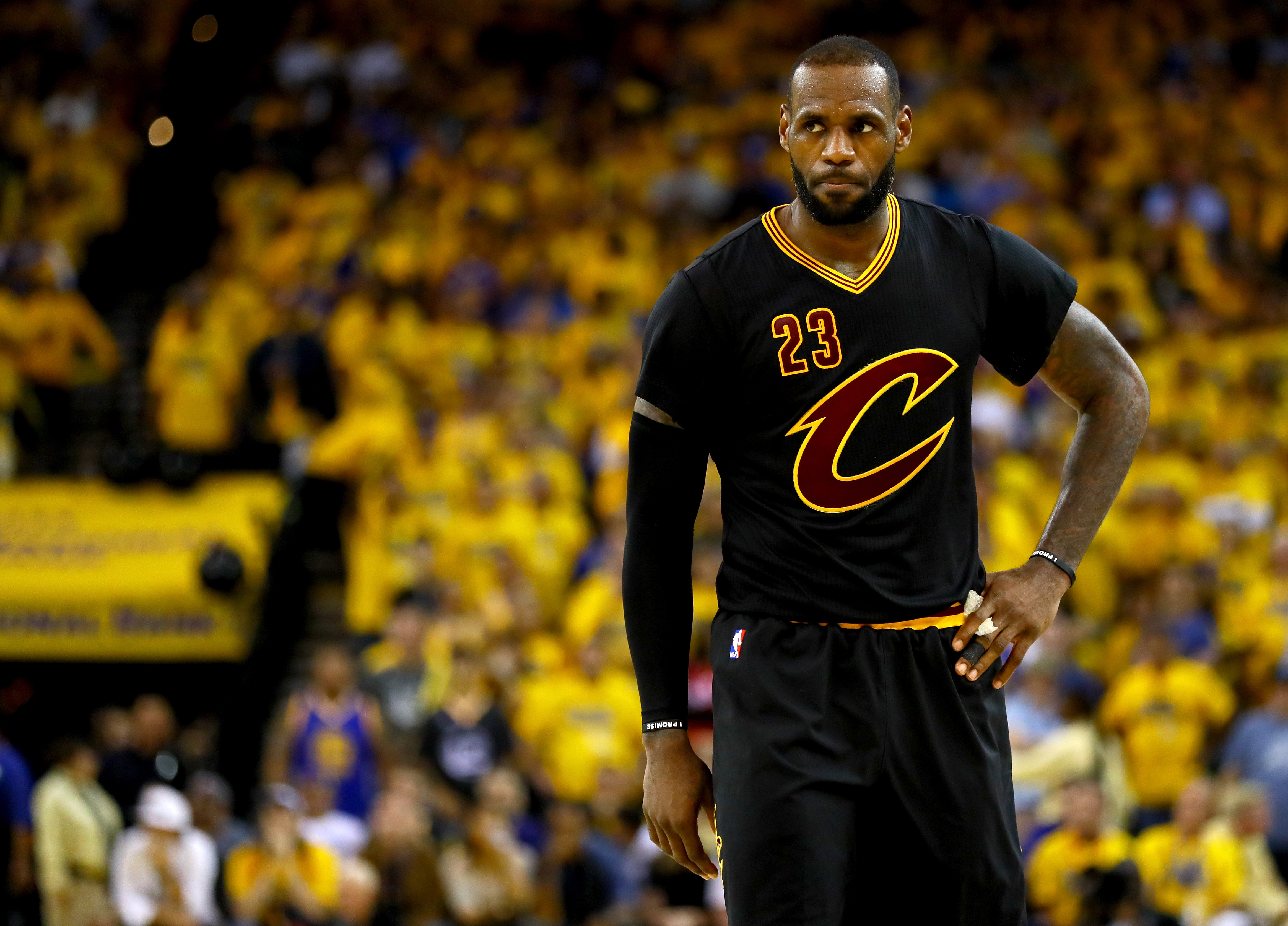 OAKLAND, CA - JUNE 19: LeBron James #23 of the Cleveland Cavaliers reacts to a play in Game 7 of the 2016 NBA Finals against the Golden State Warriors at ORACLE Arena on June 19, 2016 in Oakland, California. NOTE TO USER: User expressly acknowledges and agrees that, by downloading and or using this photograph, User is consenting to the terms and conditions of the Getty Images License Agreement.   Ezra Shaw/Getty Images/AFP