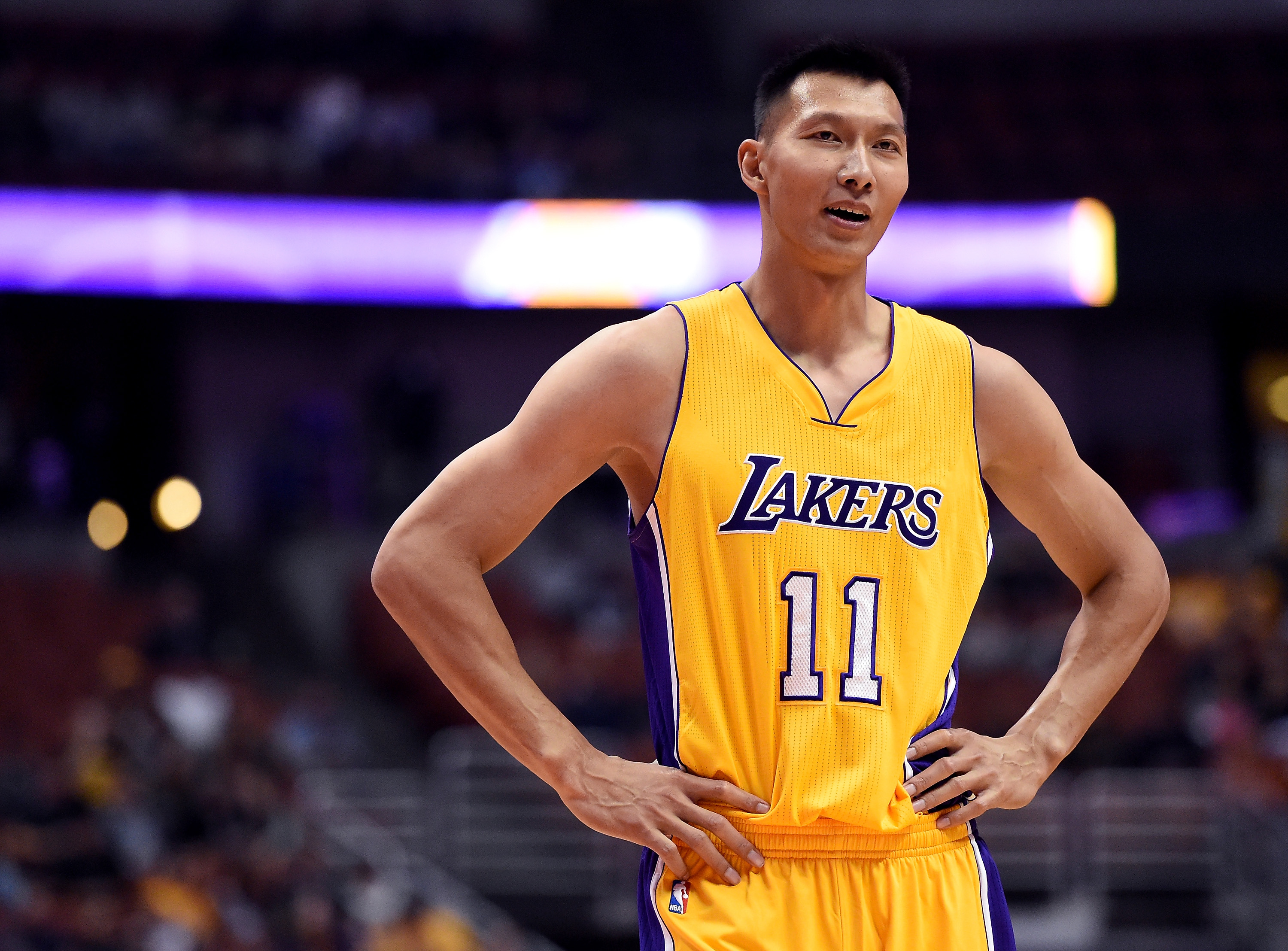 ANAHEIM, CA - OCTOBER 04: Yi Jianlian #11 of the Los Angeles Lakers reacts to his foul on DeMarcus Cousins #15 of the Sacramento Kings during a preseason game at Honda Center on October 4, 2016 in Anaheim, California. NOTE TO USER: User expressly acknowledges and agrees that, by downloading and or using this photograph, User is consenting to the terms and conditions of the Getty Images License Agreement.   Harry How/Getty Images/AFP