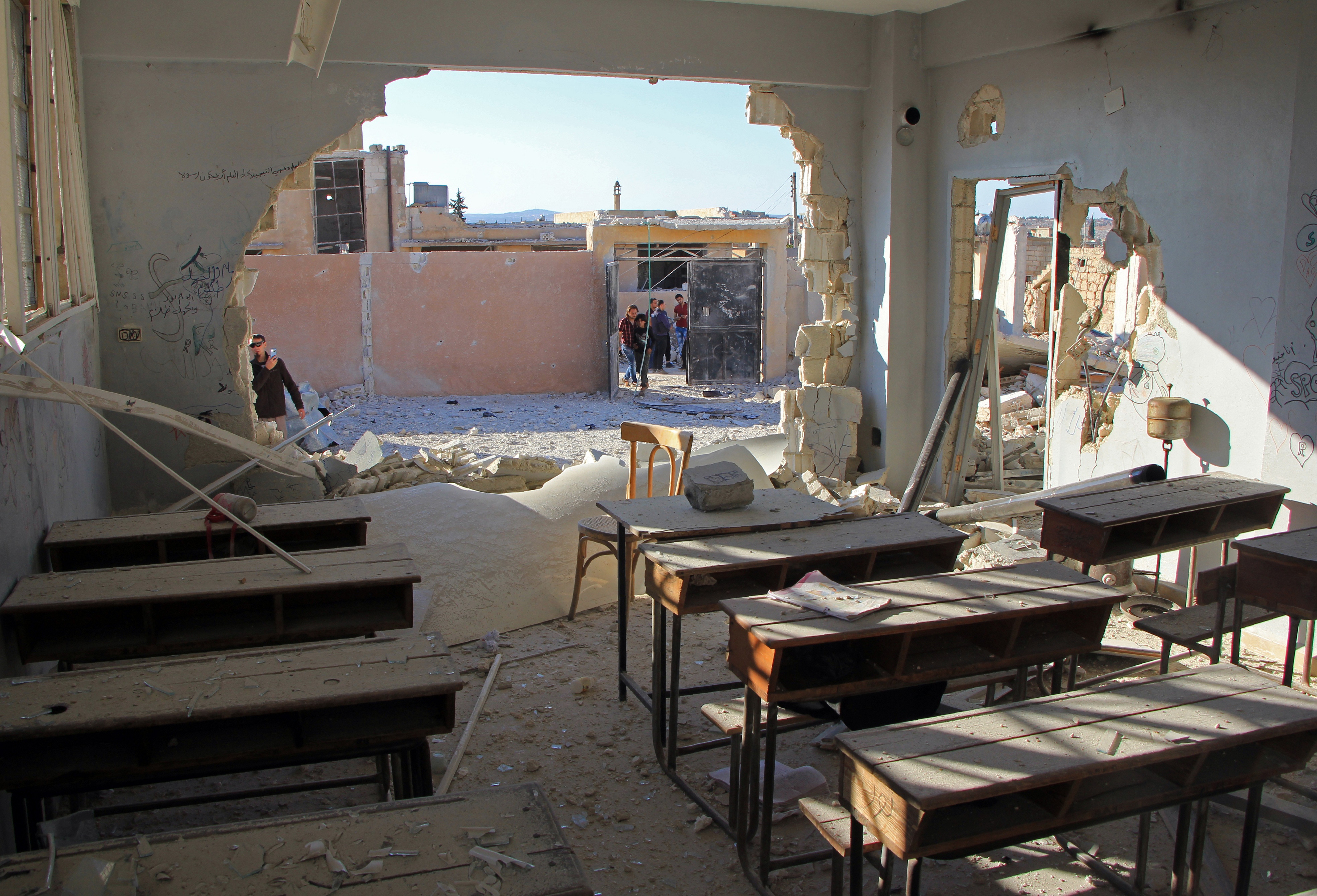 A general view shows a damaged classroom at a school after it was hit in an air strike in the village of Hass, in the south of Syria's rebel-held Idlib province on October 26, 2016. / AFP PHOTO / Omar haj kadour
